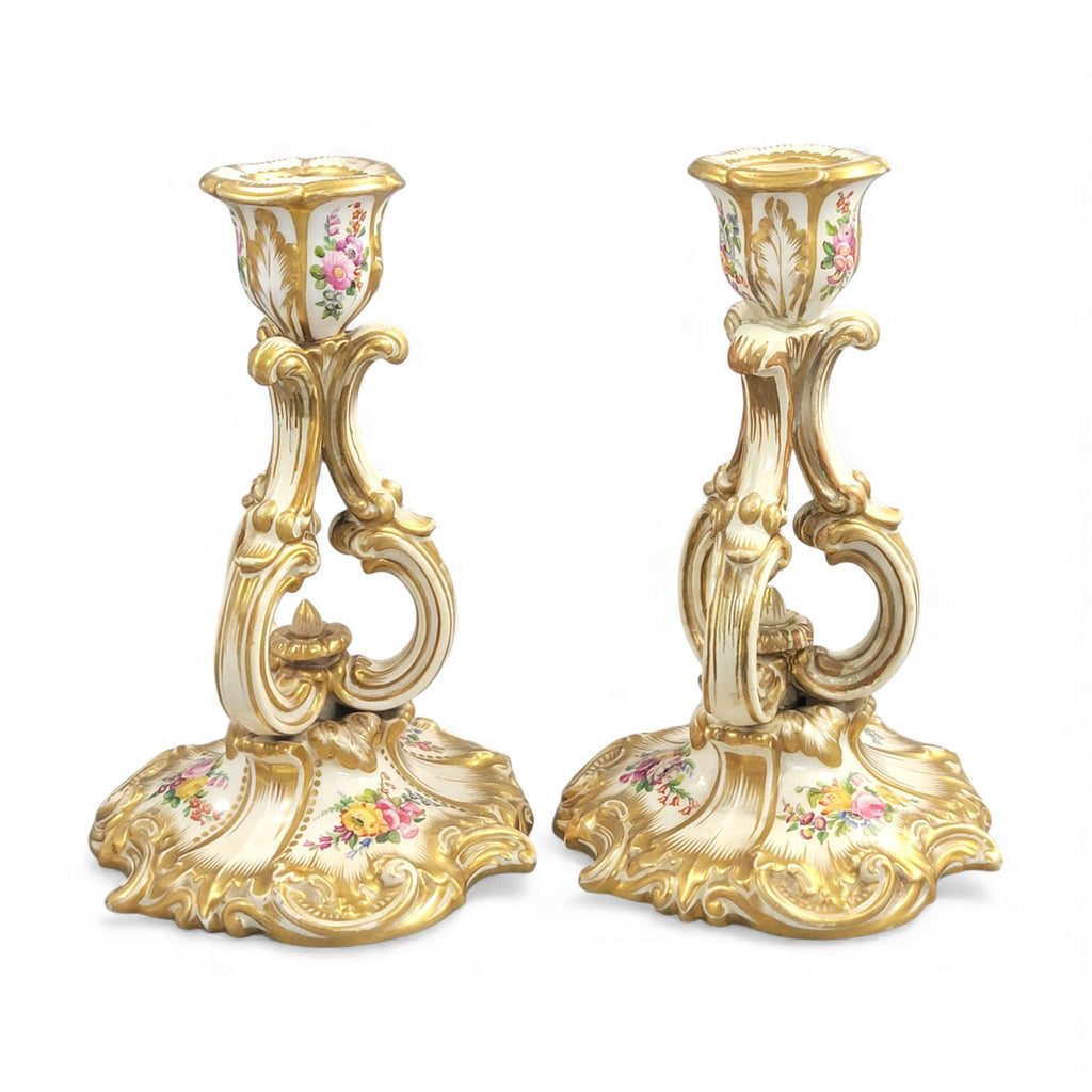 Pair of Derby rococo porcelain candlesticks c.1825–1830, hand-painted floral cups