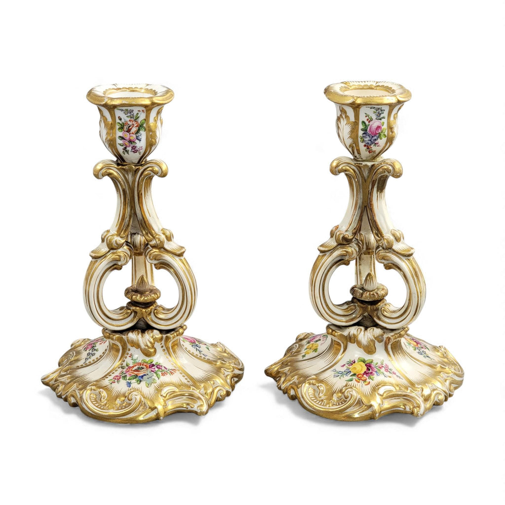 Pair of Derby rococo porcelain candlesticks c.1825–1830, hand-painted floral cups