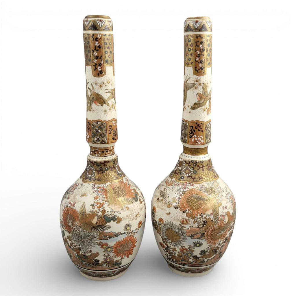 Rare pair of large Japanese Satsuma vases of elongated bottle form, dating to the Meiji period and standing approximately 38 cm high.