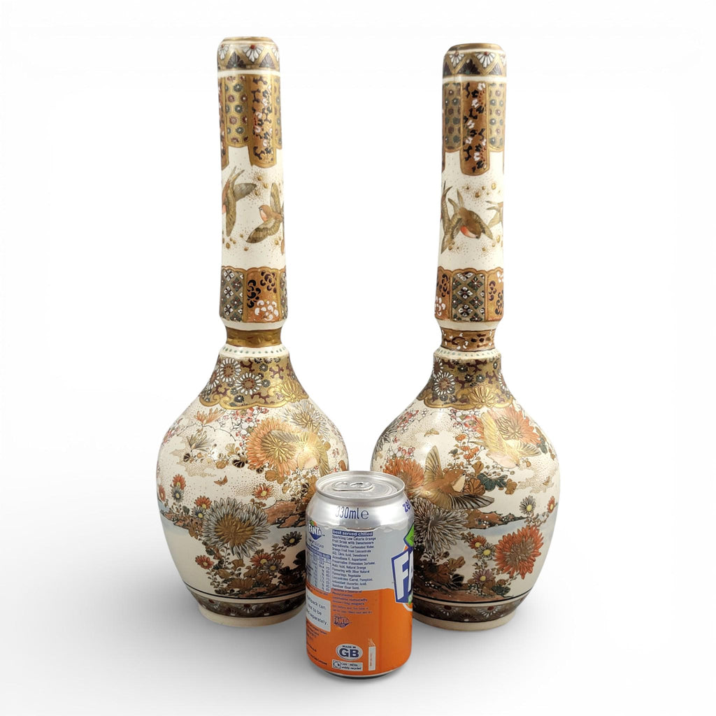Rare pair of large Japanese Satsuma vases of elongated bottle form, dating to the Meiji period and standing approximately 38 cm high.