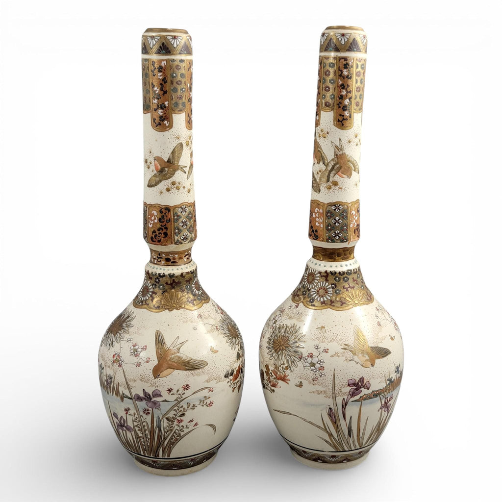 Rare pair of large Japanese Satsuma vases of elongated bottle form, dating to the Meiji period and standing approximately 38 cm high.