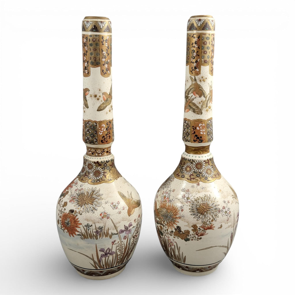 Rare pair of large Japanese Satsuma vases of elongated bottle form, dating to the Meiji period and standing approximately 38 cm high.