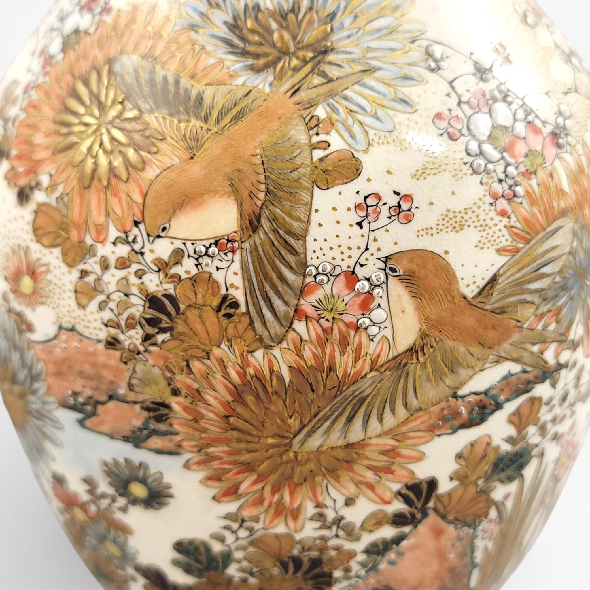 Rare pair of large Japanese Satsuma vases of elongated bottle form, dating to the Meiji period and standing approximately 38 cm high.