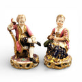 Derby Pair of Porcelain Figures “Boy Reading a Book and Girl Tatting”, c. 1785
