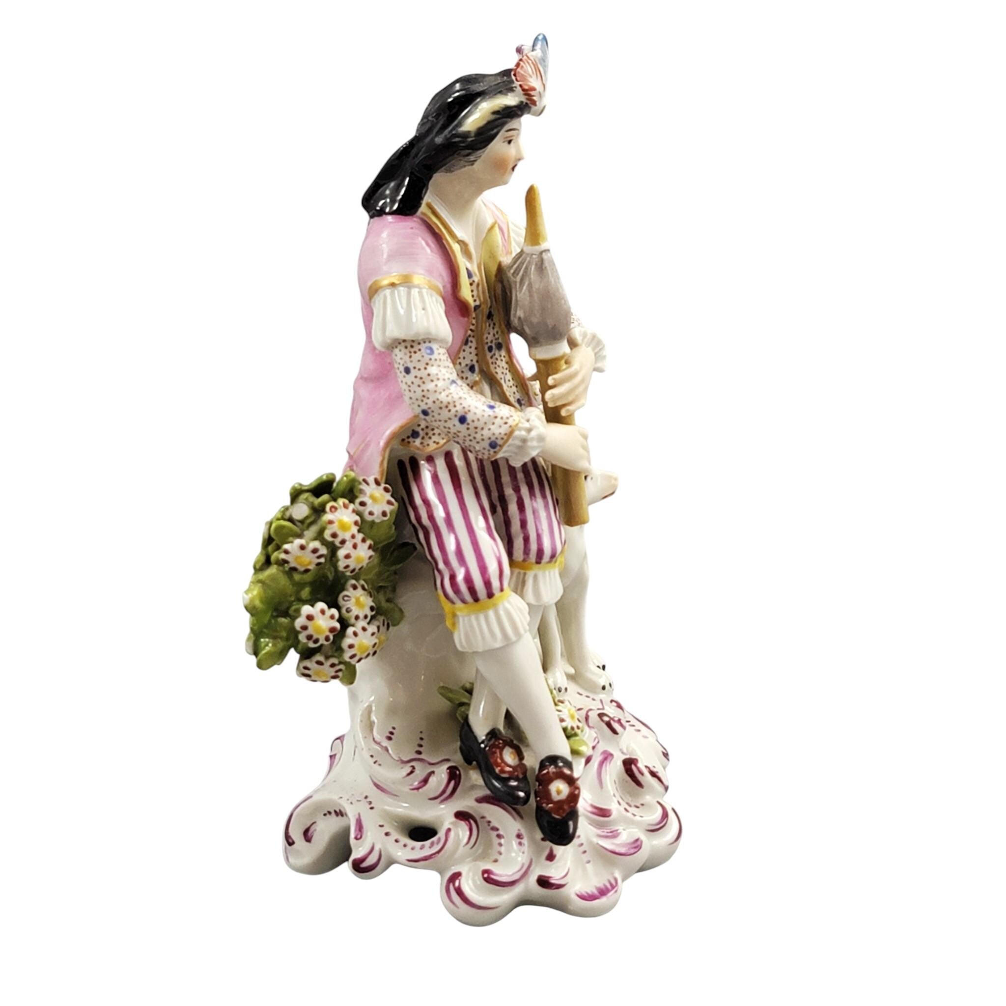 Rare Derby porcelain figure seated bagpiper dog, model 301, c. 1760