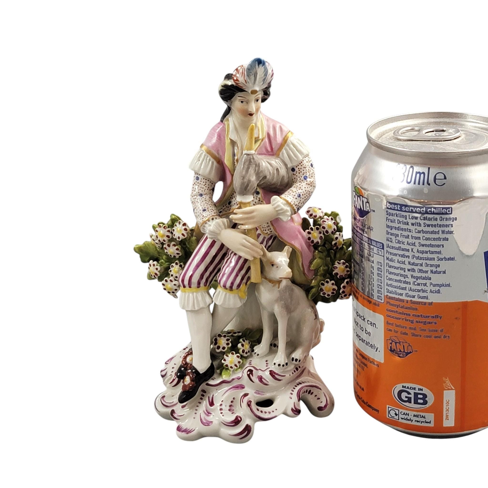 Rare Derby porcelain figure seated bagpiper dog, model 301, c. 1760