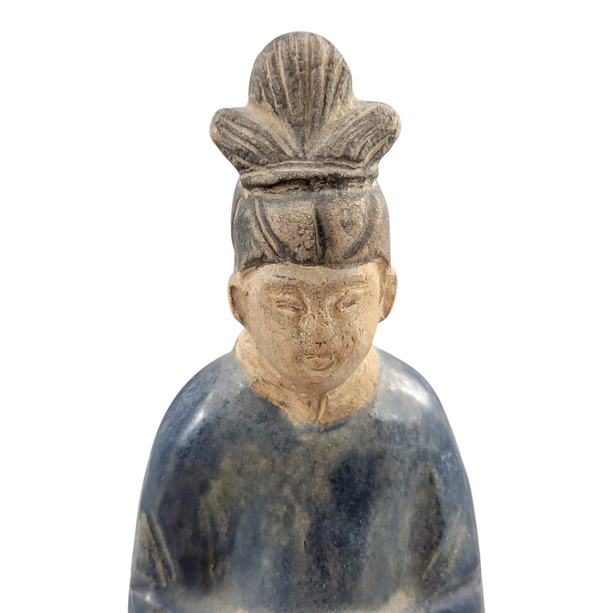 Chinese Tang sancai glazed funerary figure, court attendant, c. 7th–8th
