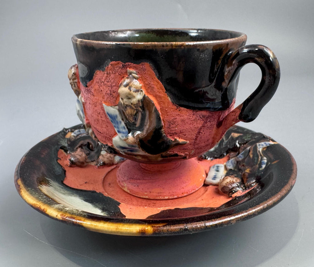 Japanese Sumida Gawa Cup and Saucer with Applied Sage Figures, Attributed to Ishiguro Kōko — Meiji / Early Taishō Period