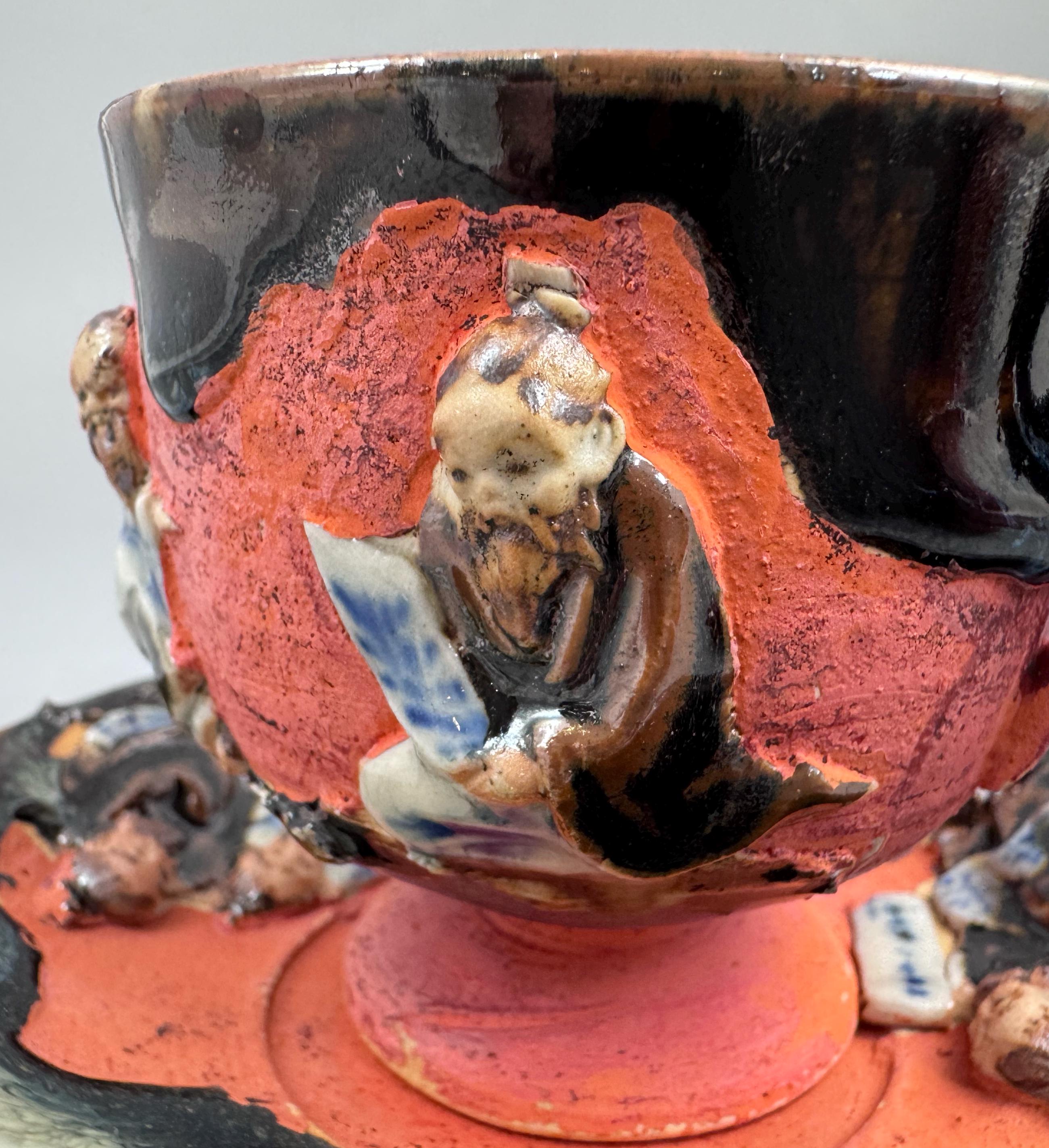 Japanese Sumida Gawa Cup and Saucer with Applied Sage Figures, Attributed to Ishiguro Kōko — Meiji / Early Taishō Period