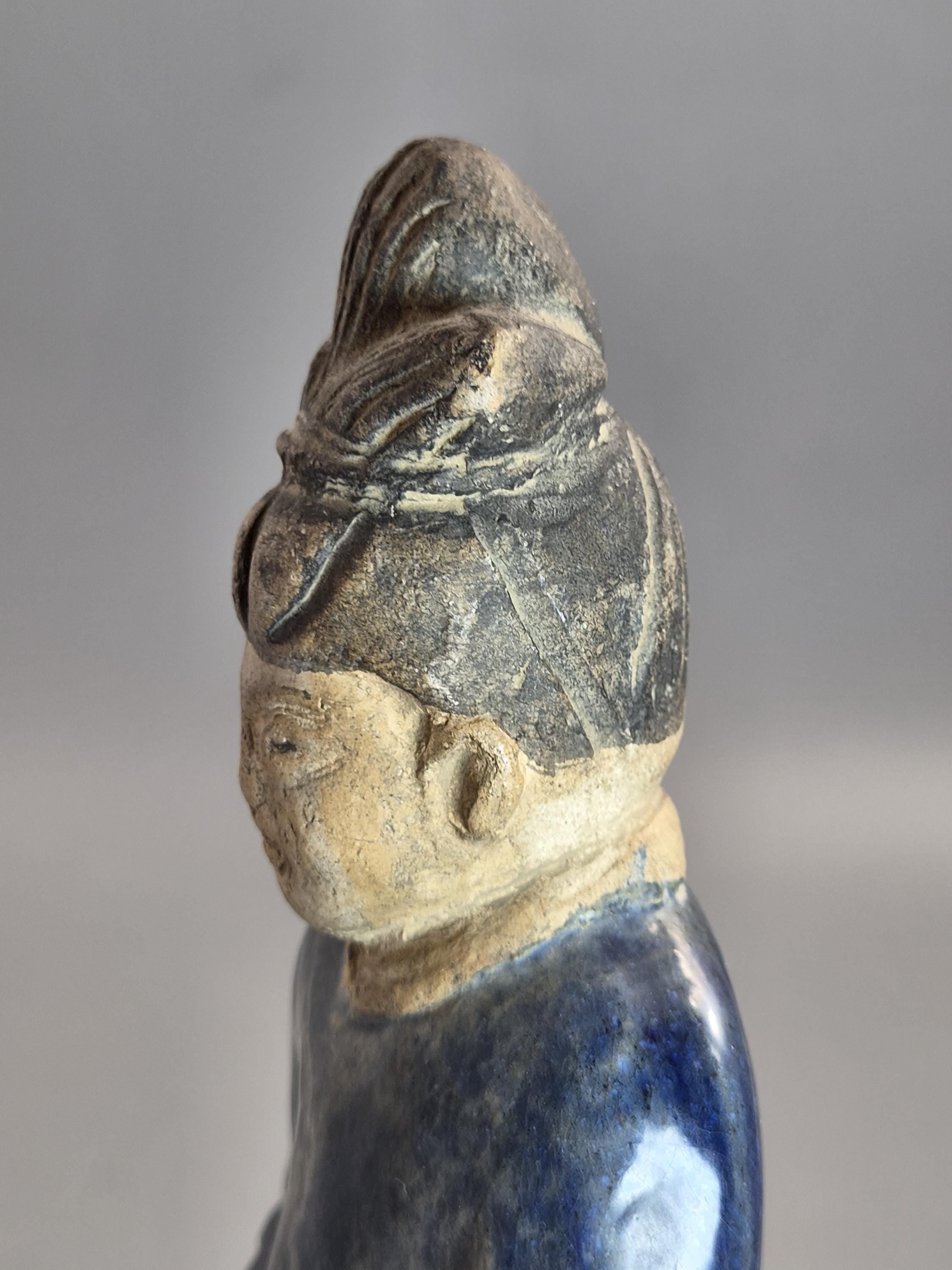 Chinese Tang sancai glazed funerary figure, court attendant, c. 7th–8th