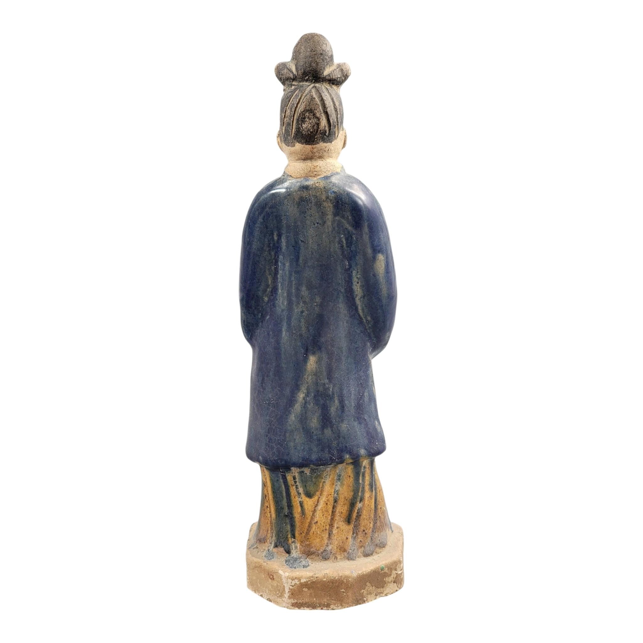 Chinese Tang sancai glazed funerary figure, court attendant, c. 7th–8th