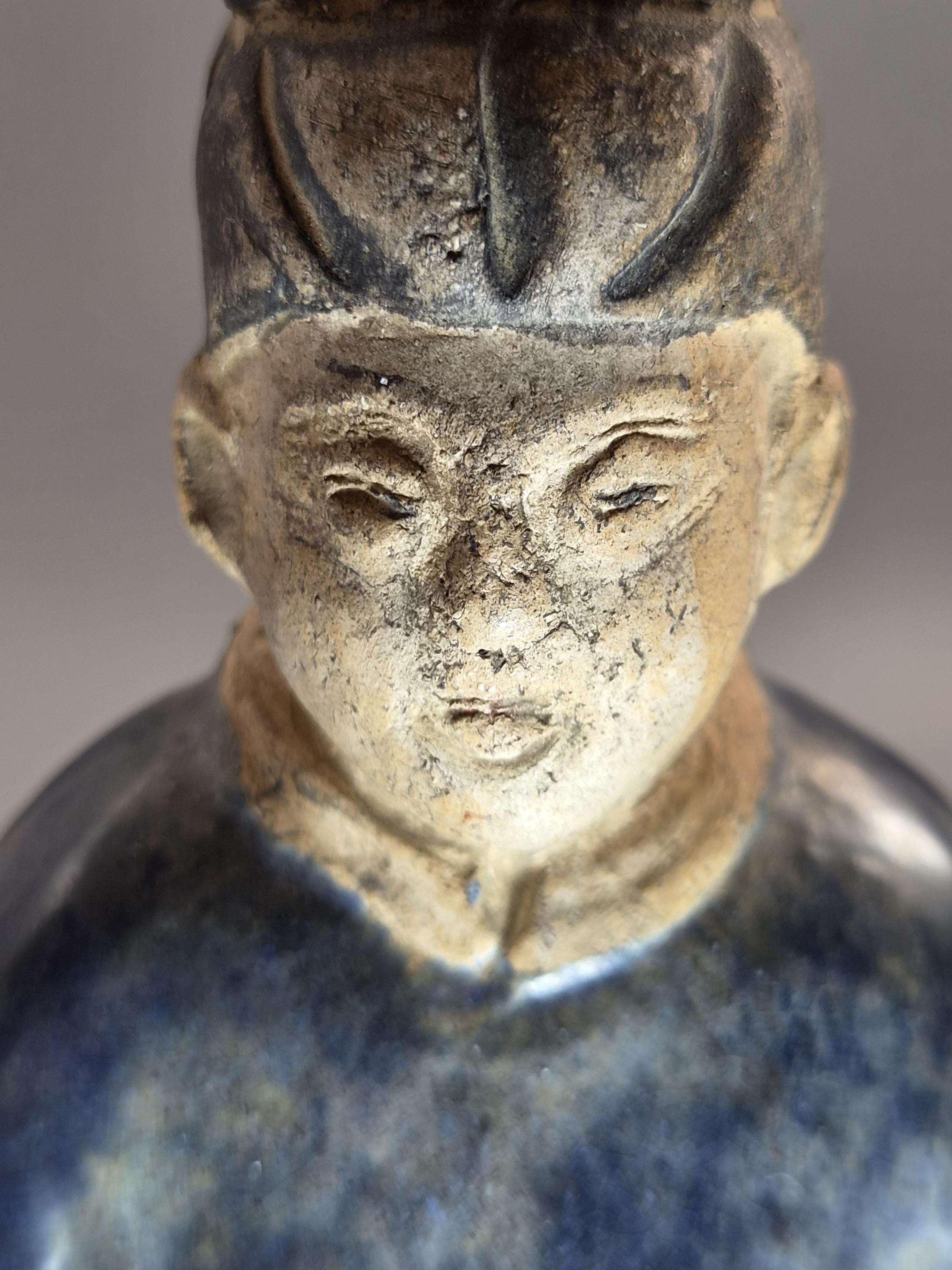 Chinese Tang sancai glazed funerary figure, court attendant, c. 7th–8th