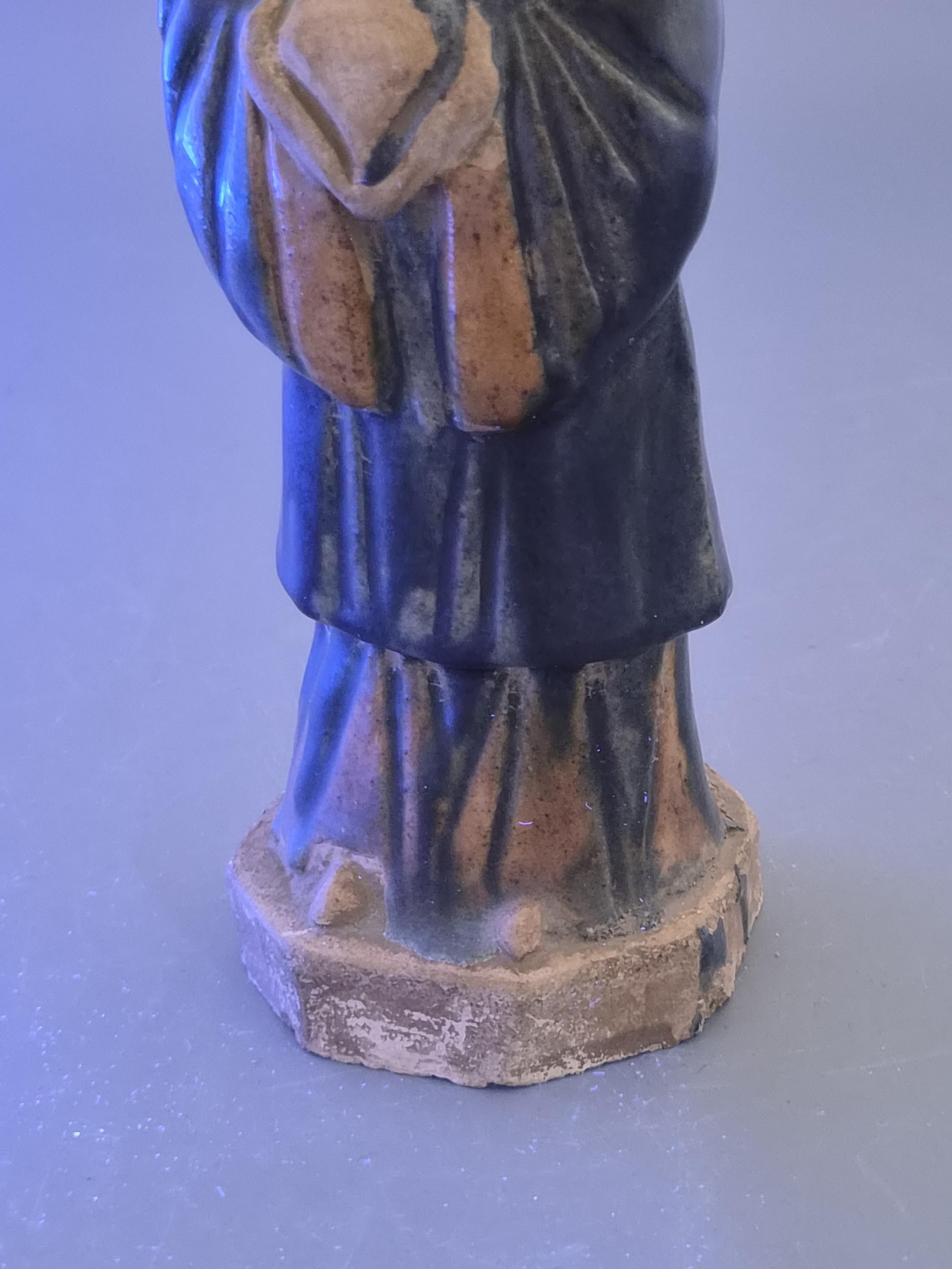 Chinese Tang sancai glazed funerary figure, court attendant, c. 7th–8th
