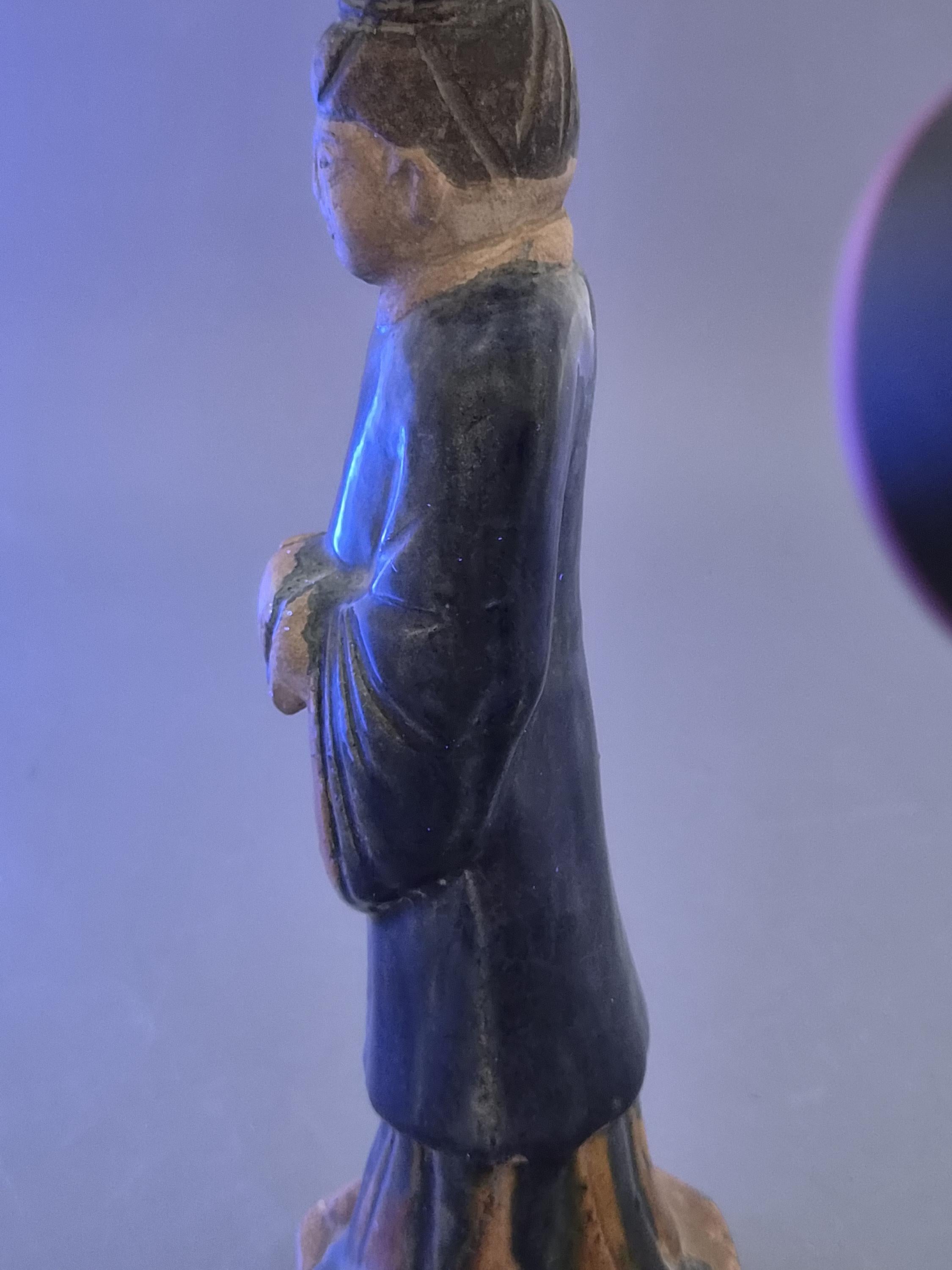 Chinese Tang sancai glazed funerary figure, court attendant, c. 7th–8th
