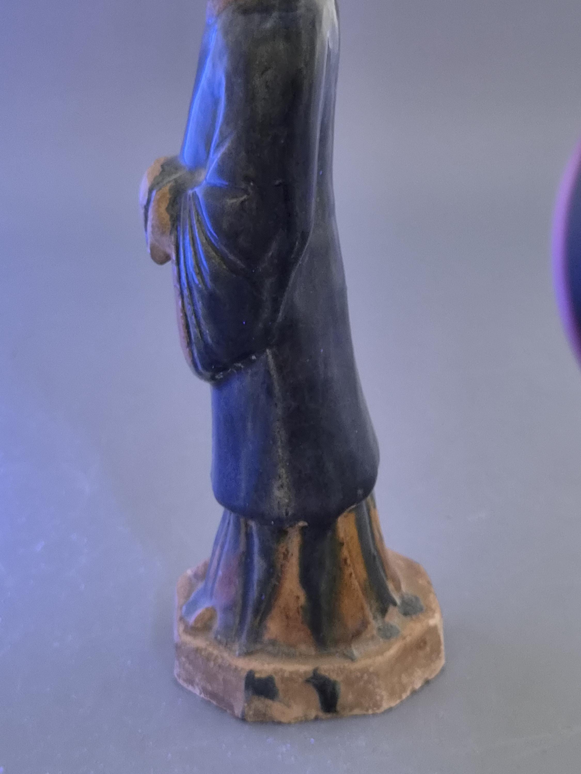 Chinese Tang sancai glazed funerary figure, court attendant, c. 7th–8th