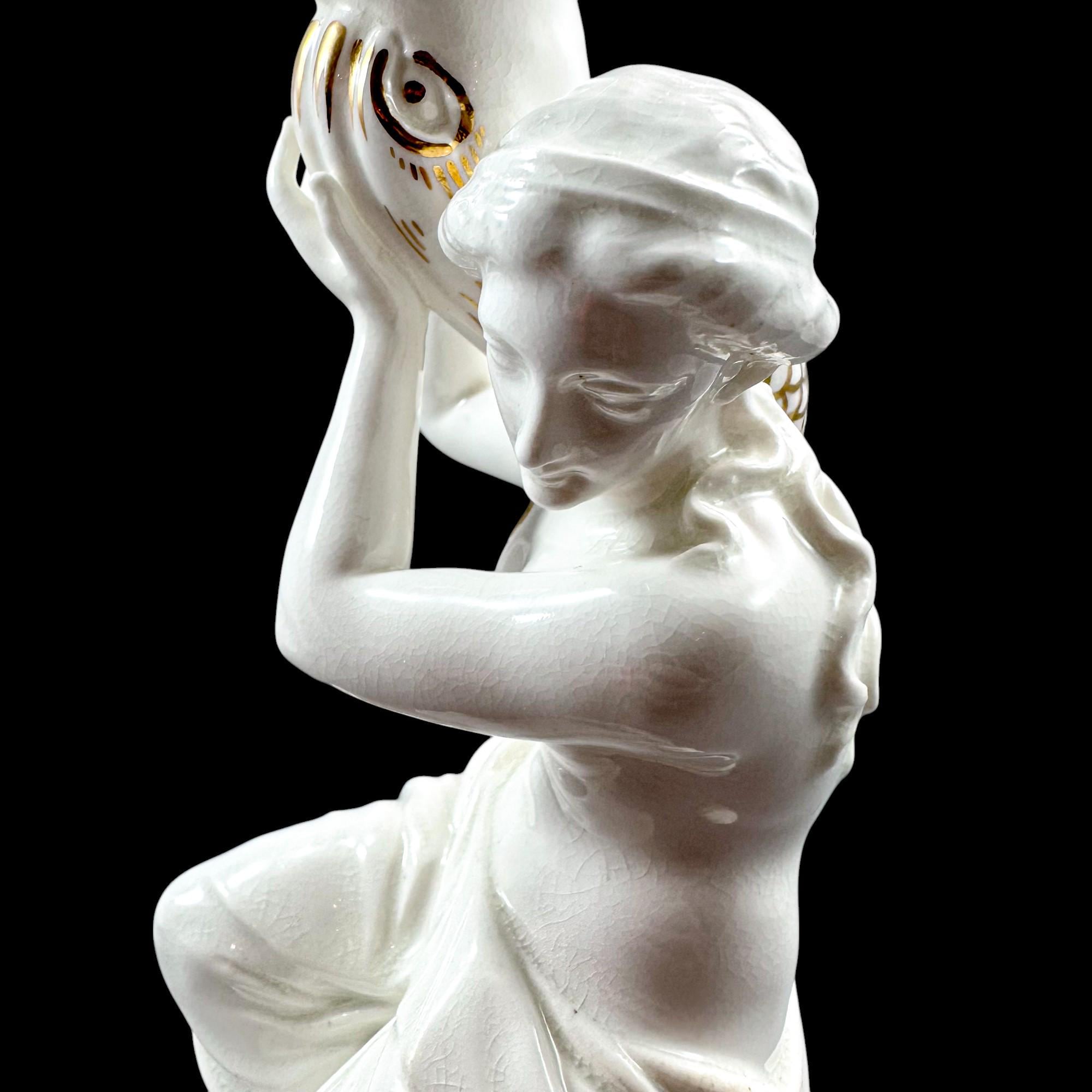 Pair of Victorian English porcelain figural candlesticks, Sutherland & Sons style, Neoclassical ladies with dolphin, antique Staffordshire