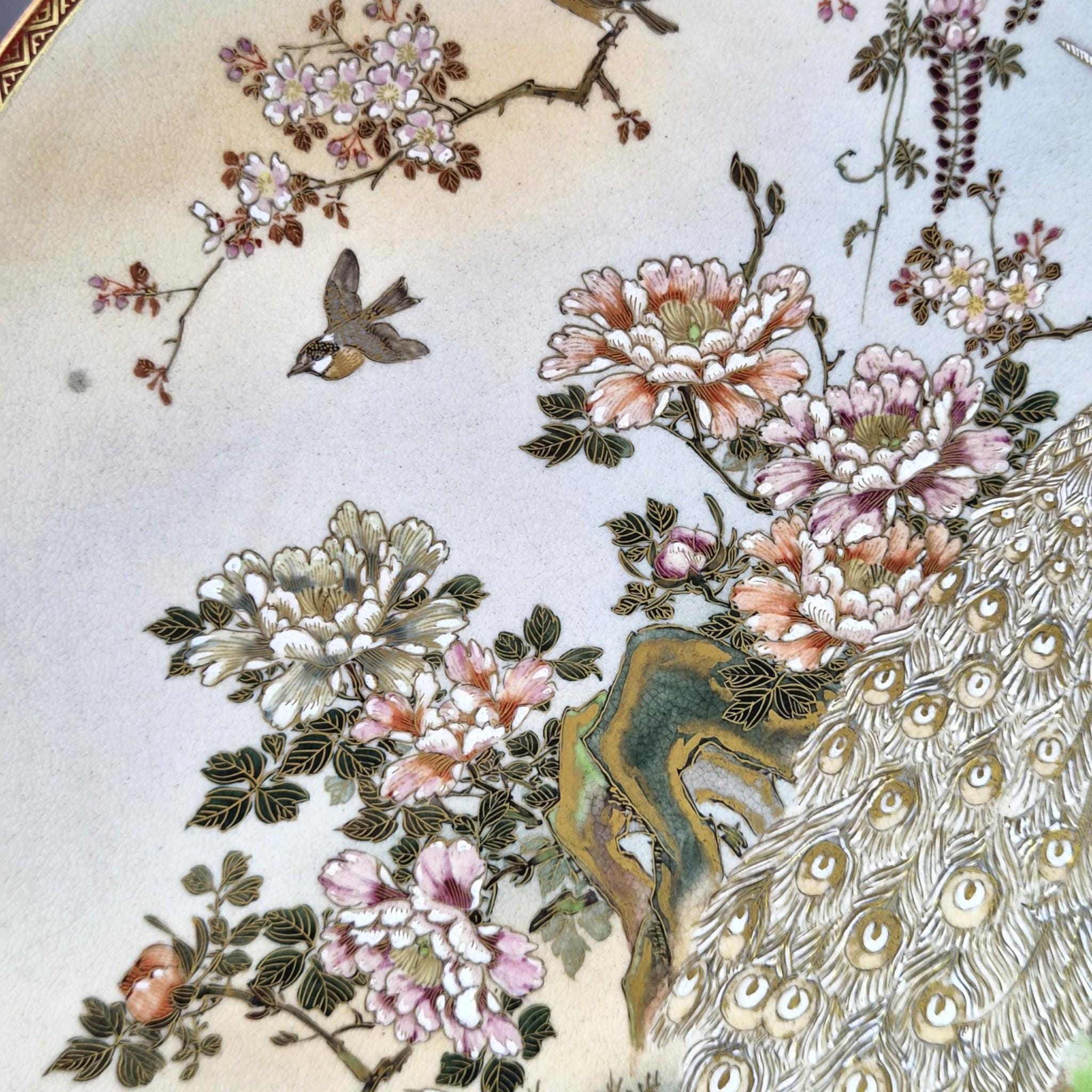 Large Meiji Japanese Satsuma Moriage charger with peacocks, wisteria and peonies, 31 cm export ware c.1890–1915