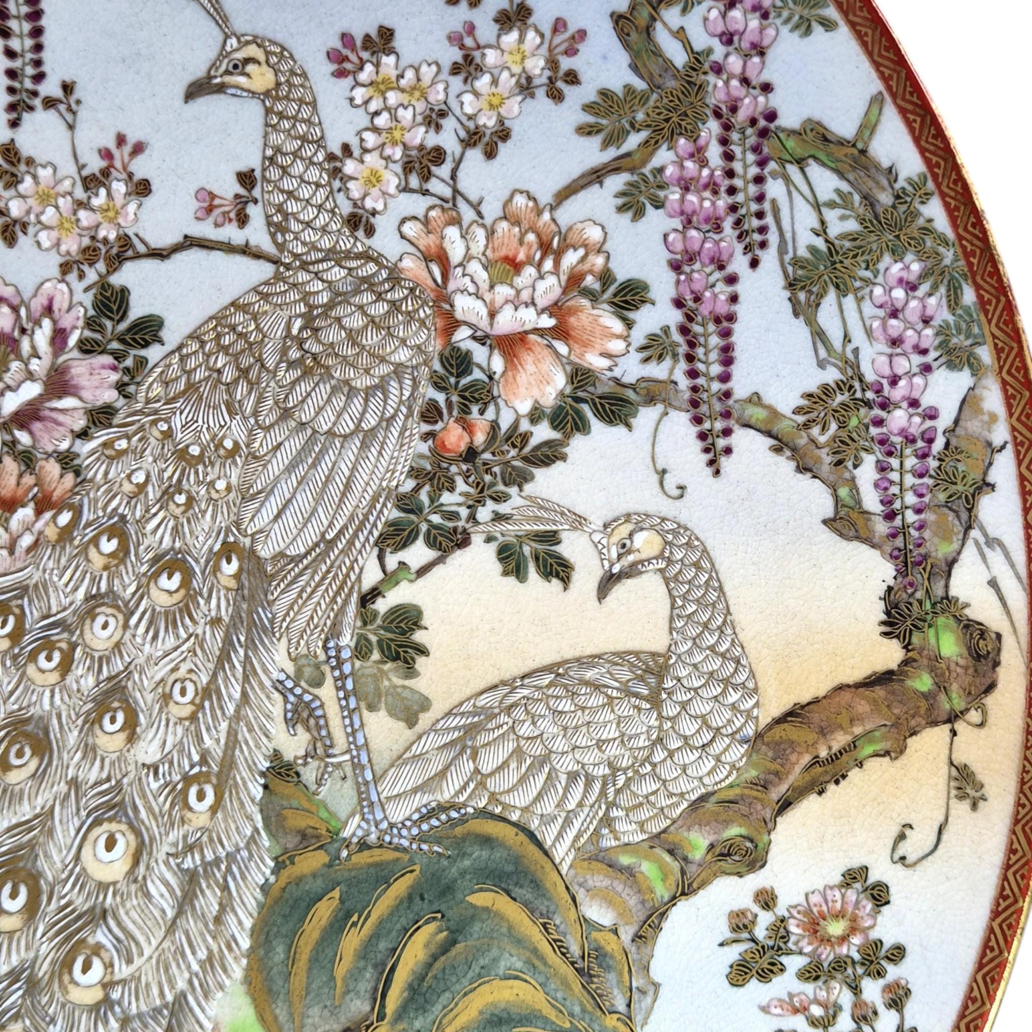 Large Meiji Japanese Satsuma Moriage charger with peacocks, wisteria and peonies, 31 cm export ware c.1890–1915