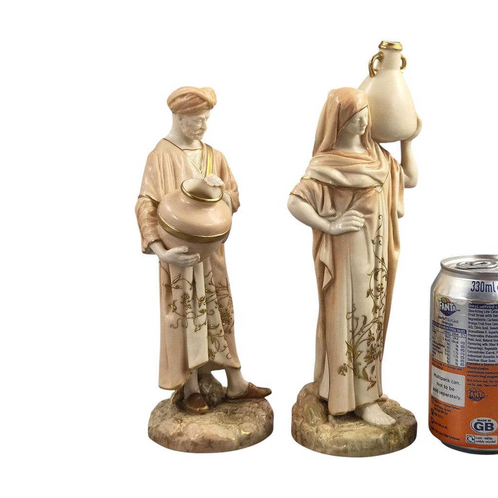Royal Worcester Blush Ivory Cairo Water Carriers by James Hadley, Pair of Orientalist Porcelain Figures, 1901-1902