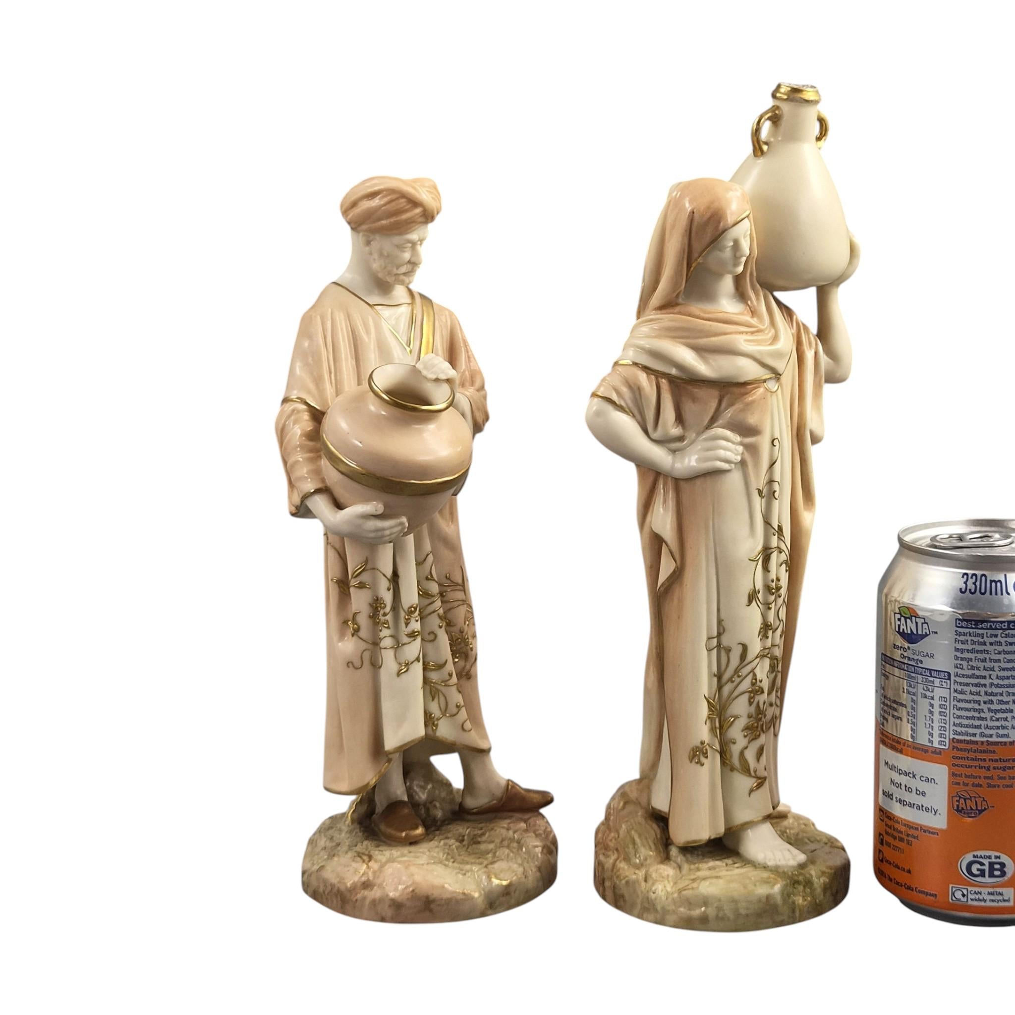 Royal Worcester Blush Ivory Cairo Water Carriers by James Hadley, Pair of Orientalist Porcelain Figures, 1901-1902